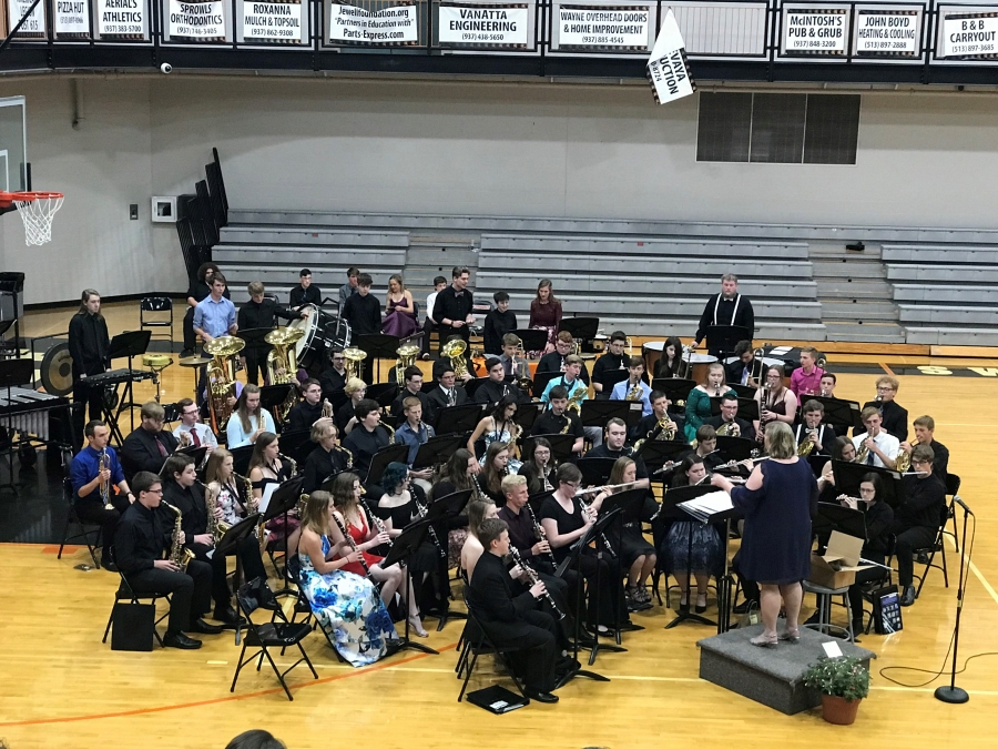 band members seated in chairs